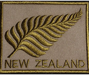 Partially embroidered silver fern patch of new zealand in gold includes new zealand in text made in new zealand