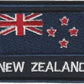 Partially embroidered flag patch of new zealand in navy blue includes new zealand in text made in new zealand